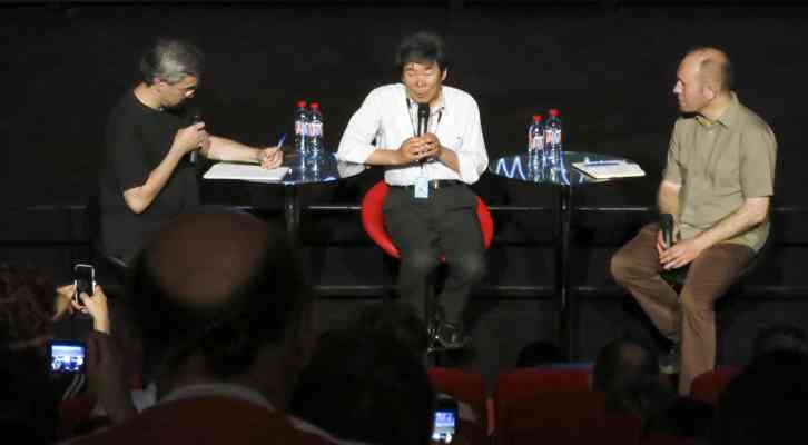 De izquierda a derecha, Ilan Nguyên, traductor, Isao Takahata y Xavier Kawa-Topor. Festival Internacional de Cine de Animación de Annecy 2014.